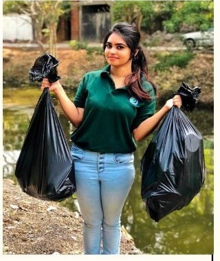 Sanali participating in an environmental cleanup activity