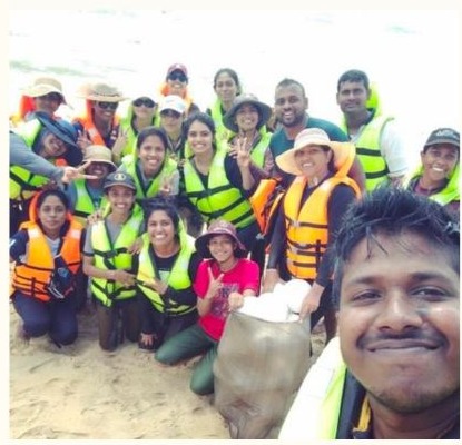 Environmental field team working together in safety equipment