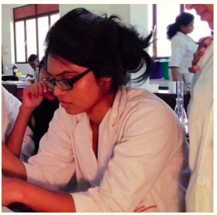 Sanali conducting detailed laboratory bench work