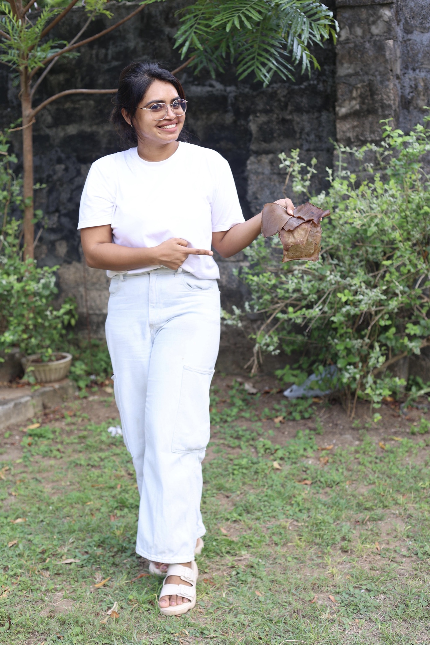 Sanali presenting seaweed-derived biomaterial samples outdoors